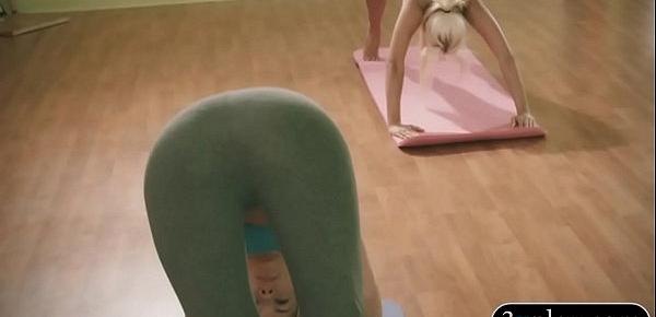  Yoga teacher teaching yoga exercises